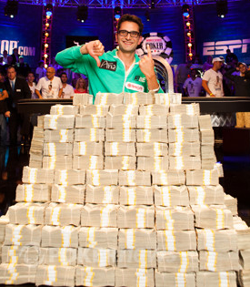 Antonio Esfandiari poses with his new mountain of cash - a cool $18 million