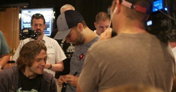 Negreanu surrounded by poker fans and poker media