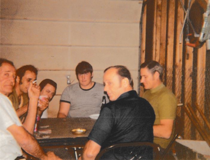 Frank Hoerst Jr. playing cards with family
