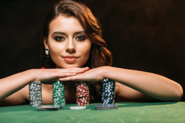 girl resting on poker chips