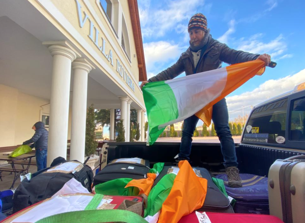 Nealon on back of van with Irish flag