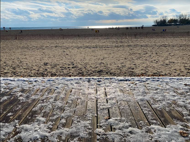 snow on boardwalk